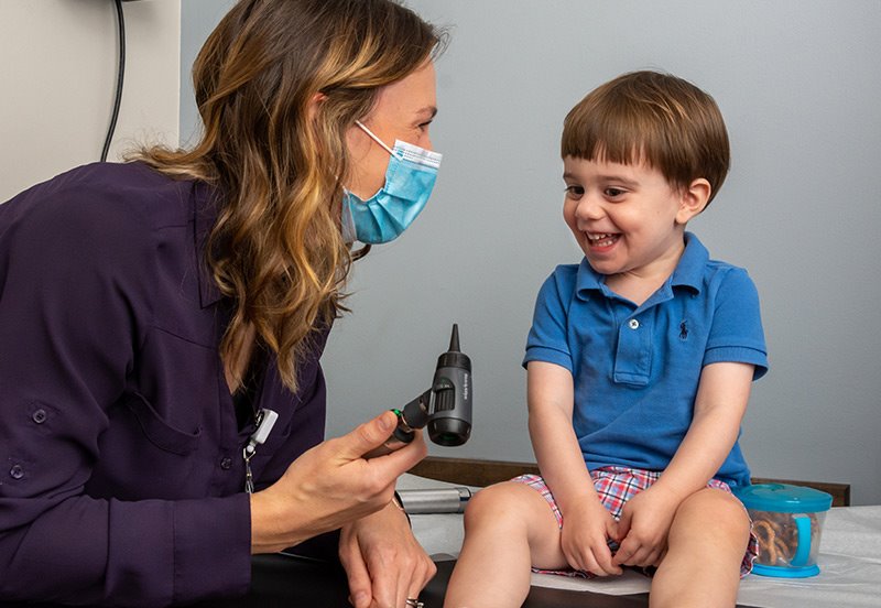 Pediatrician checking on child with antibiotic resistance