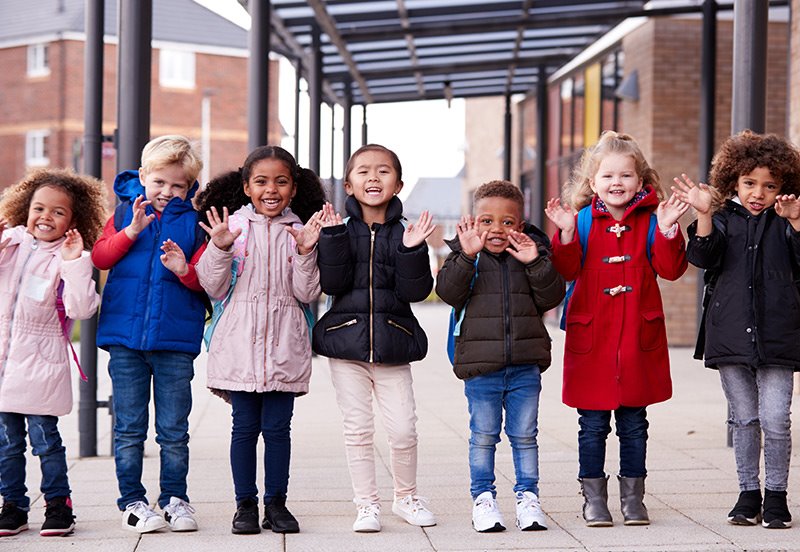 children with coats on during the winter