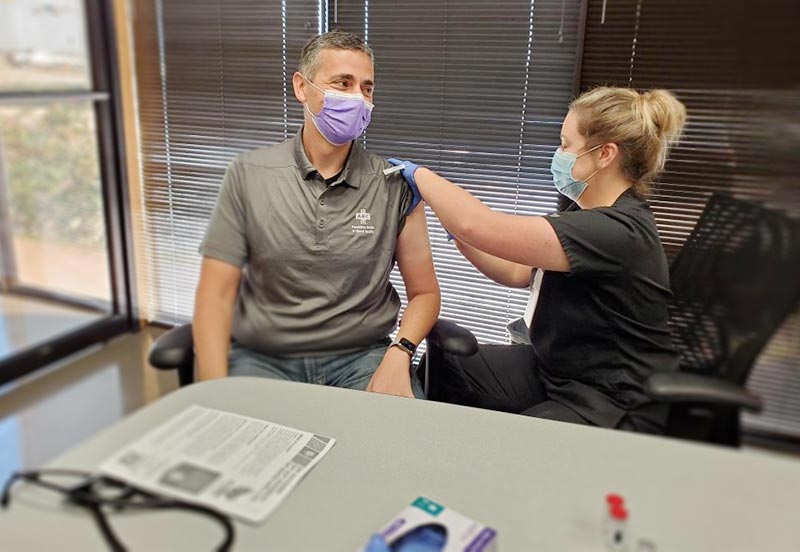 Austin Regional Clinic Patient receiving the first doze of the Moderna Covid-19 vaccine