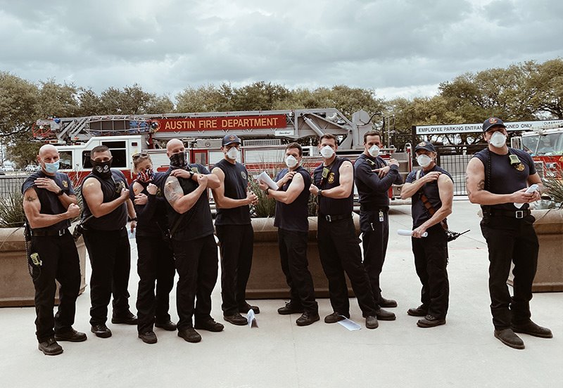 Austin area firefighters flexing after receiving the Covid-19 vaccine at ARC