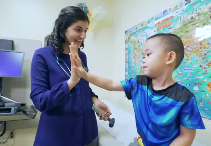 Pediatrician helping child prevent obesity