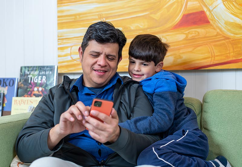 Father and son using ARC myChart