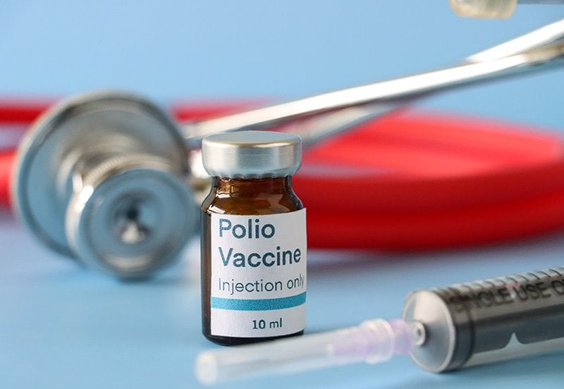 Polio vaccine and syringe