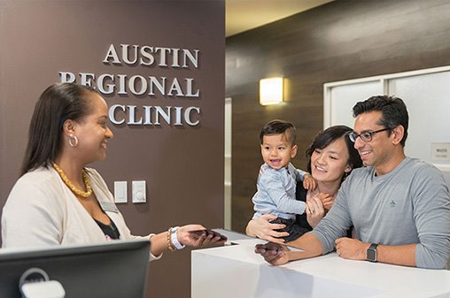 A family checking in at ARC clinic